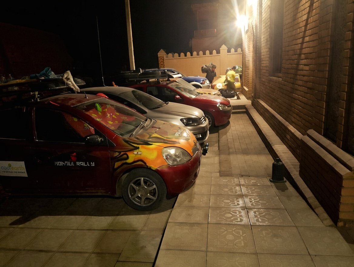 Private hotel parking area at night with secure access